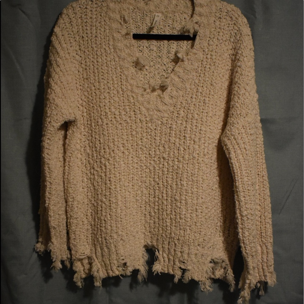 Distressed edge sweater